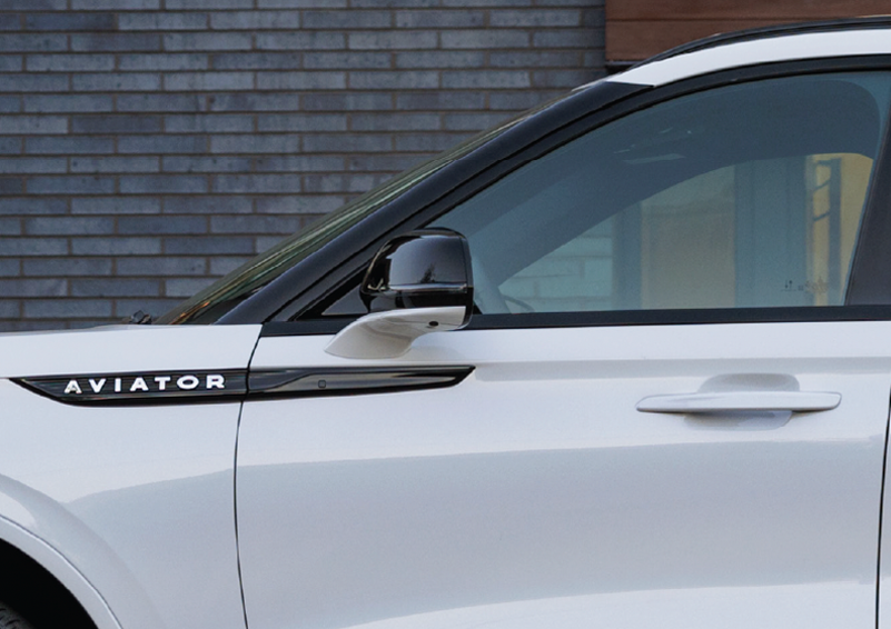 The driver’s door of a white 2025 Lincoln Aviator® SUV is showcased. | Bayway Lincoln in Houston TX