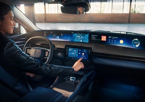 The driver of a 2025 Lincoln Nautilus® SUV interacts with the center touchscreen. | Bayway Lincoln in Houston TX