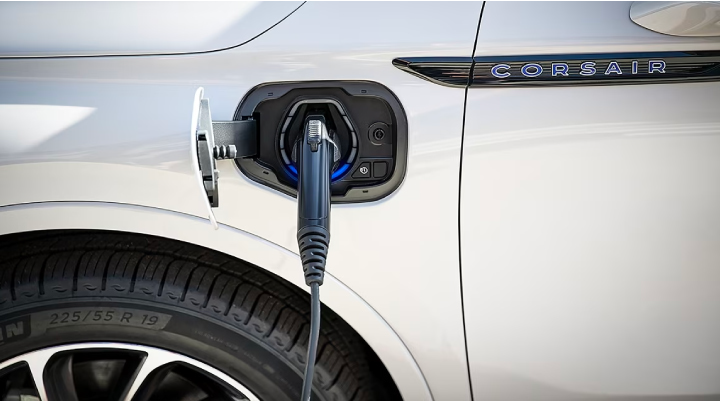 An electric charger is shown plugged into the charging port of a Lincoln Corsair® Grand Touring
model. | Bayway Lincoln in Houston TX