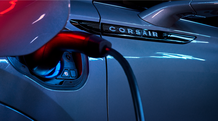 A charger plugged into the charging port of a 2025 Lincoln Corsair® Plug-in Hybrid model. | Bayway Lincoln in Houston TX