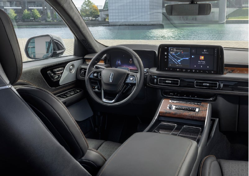 The interior of the 2026 Lincoln Aviator® SUV is shown parked with a view of a harbor through the windshield. | Bayway Lincoln in Houston TX