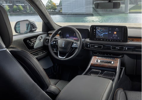 The interior of the 2026 Lincoln Aviator® SUV is shown parked with a view of a harbor through the windshield. | Bayway Lincoln in Houston TX