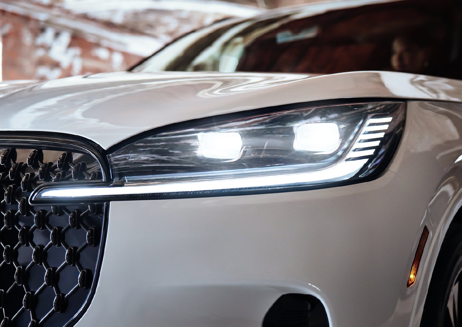 A close-up of a headlamp on the 2027 Lincoln Aviator® SUV is shown. | Bayway Lincoln in Houston TX