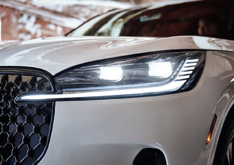 A close-up of a headlamp on the 2027 Lincoln Aviator® SUV is shown. | Bayway Lincoln in Houston TX