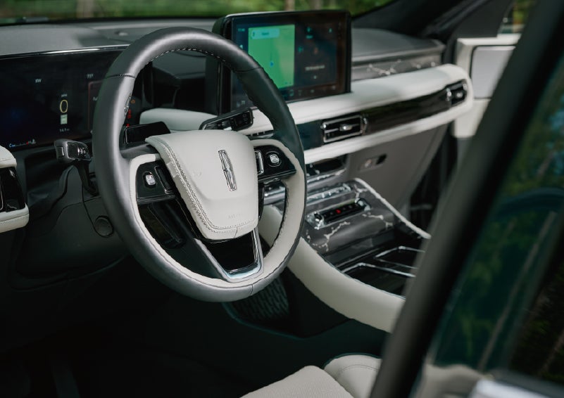 The leather-trimmed steering wheel of a 2027 Lincoln Aviator® Black Label™ SUV. | Bayway Lincoln in Houston TX