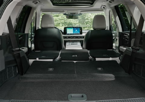 A rear to front view of the interior of a 2027 Lincoln Aviator® Black Label™ SUV shows the third and second rows folded flat | Bayway Lincoln in Houston TX